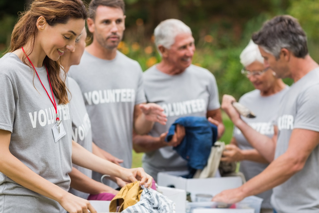 Group of volunteers sorting out donated items