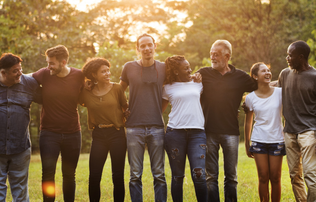 people smiling while standing