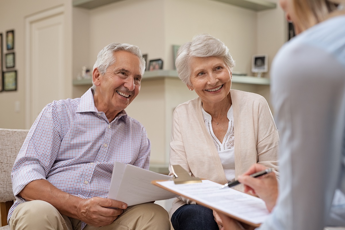 Old husband and wife with financial advisor