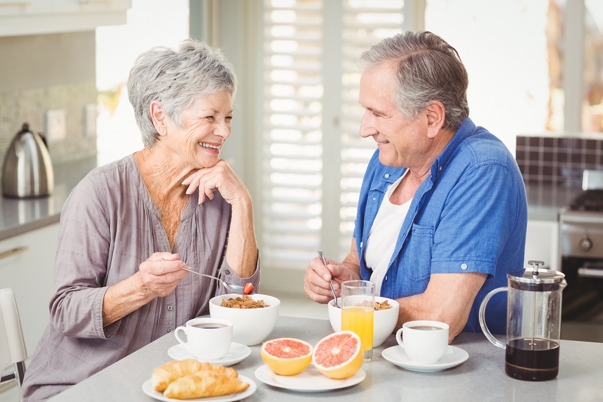 man and woman having their breakfast